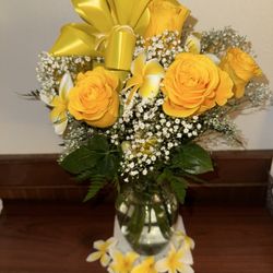 JC's Flowers - Half dozen Yellow Roses that I placed the plumerias in for the photo, we will be tossing the Lei in the ocean to honor my MIL