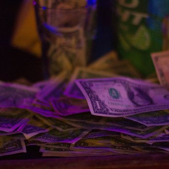 Goldfinger - a pile of money on a table - Dance Clubs Near Me - Sunrise, Florida Goldfinger - a pile of money on a table - Dance Clubs Near Me - Sunrise, Florida