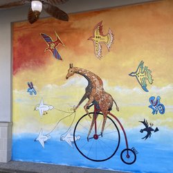 Giraffe On A Unicycle Mural