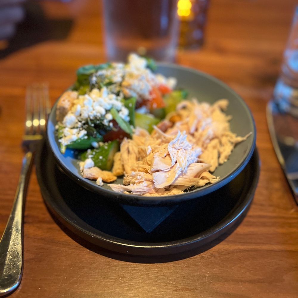 Corinne Austin - Tomato salad with chicken. - New American Near Me - Austin, Texas Corinne Austin - Tomato salad with chicken. - New American Near Me - Austin, Texas