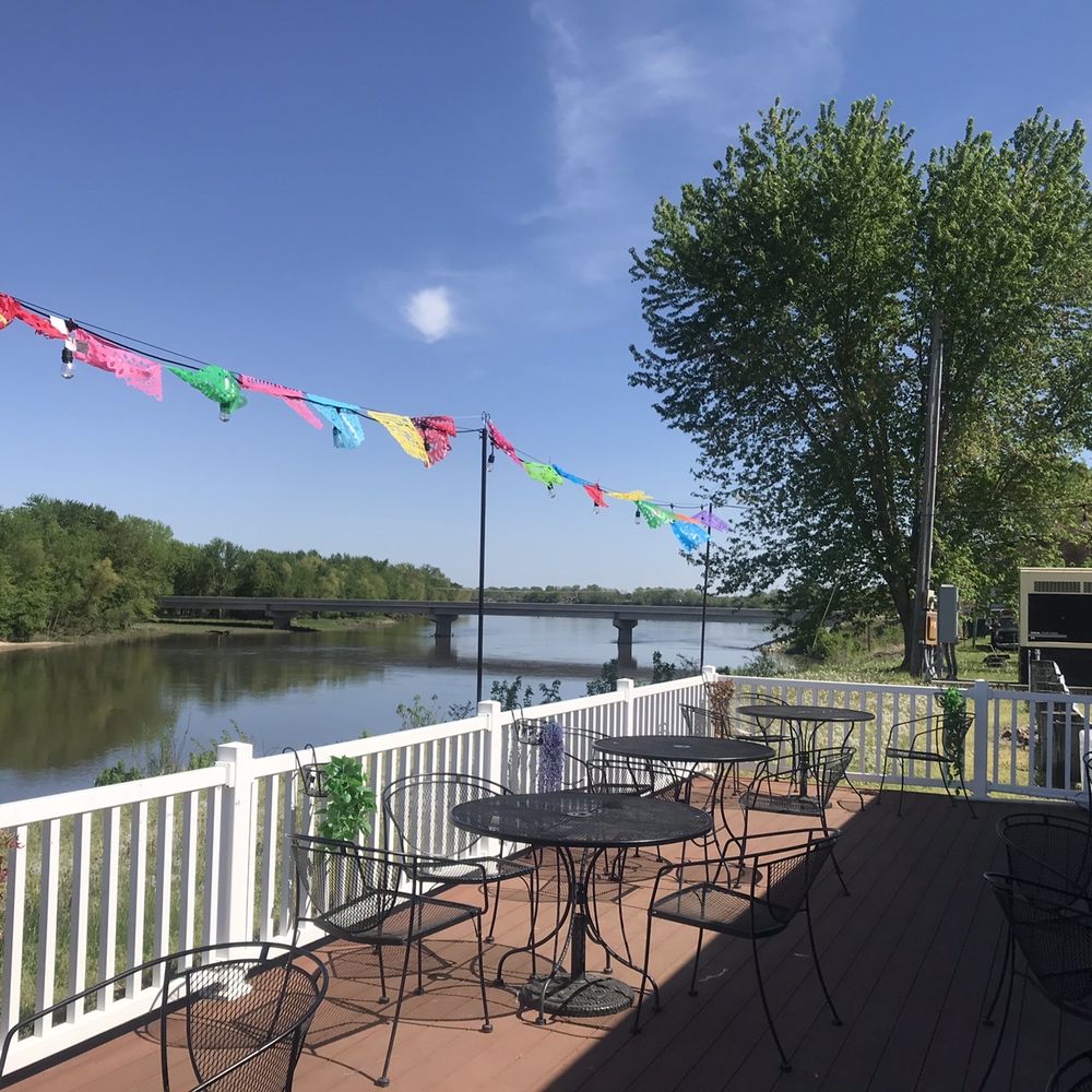 Arandas 3 - a patio with tables and chairs overlooking a river - Mexican Near Me - Wapello, Iowa