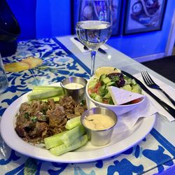 Gyro plate with out pita and a glass of Chardonnay