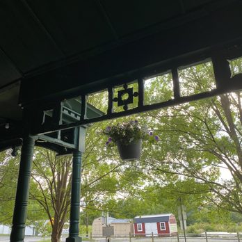 Rogues Harbor Inn - Sitting on the patio - Hotels Near Me - Lansing, New York