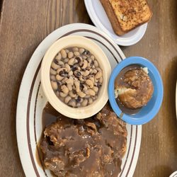 Famous Amos Restaurant - Country fried steak baked potatoes and black eyed peas with garlic toast