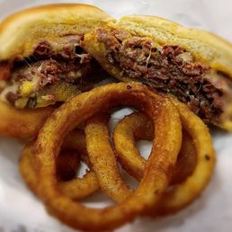 a sandwich and onion rings a sandwich and onion rings