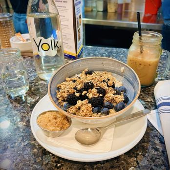 Yolk - Marina City - Berry oatmeal granola with iced chai latte - Breakfast & Brunch Near Me - Chicago, Illinois Yolk - Marina City - Berry oatmeal granola with iced chai latte - Breakfast & Brunch Near Me - Chicago, Illinois