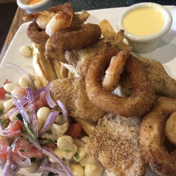 Lima Criolla Peruvian Restaurant - Jalea - Fried seafood over yuca and salad - Latin American Near Me - Austin, Texas Lima Criolla Peruvian Restaurant - Jalea - Fried seafood over yuca and salad - Latin American Near Me - Austin, Texas