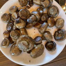 Half eaten plate of mushrooms