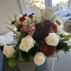 Special order white roses in an autumn themed bouquet