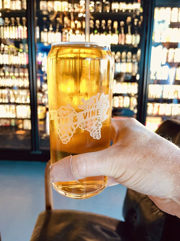 Hop & Vine Bottle Shop and Taproom Logo