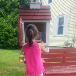 Marieville Little Library - A little angel adding to the collection.