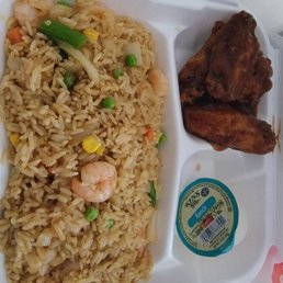 rice, meat, and vegetables in a styrofoam container