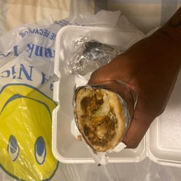 a hand holding a sandwich a hand holding a sandwich
