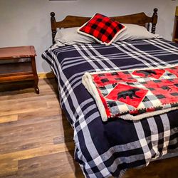 Olympic Adventure Cabin - The spacious bed inside the rustic cabin.