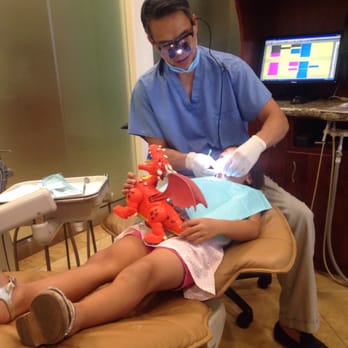 Northwest Dental Arts - Dr. Nguyen and the toy dragon with his biggest fan. - General Dentistry Near Me - Bakersfield, California