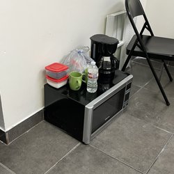 Bella Beauty College - This is the break room students have to warm up their food in a microwave that's on the floor!