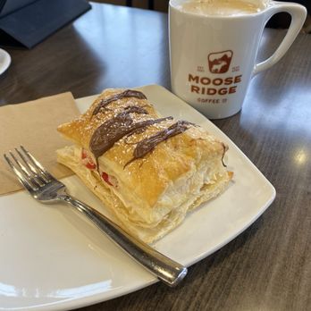 Moose Ridge Coffee - Napoleon with White Chocolate with Cayenne Mocha made with oat milk. - Coffee & Tea Near Me - Idaho Falls, Idaho Moose Ridge Coffee - Napoleon with White Chocolate with Cayenne Mocha made with oat milk. - Coffee & Tea Near Me - Idaho Falls, Idaho