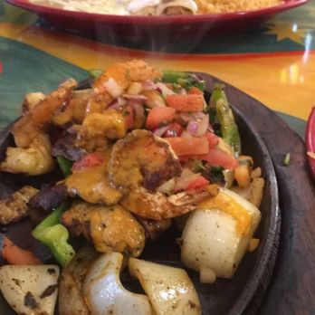 Salsa & Beer - Guadalajara spicy fajitas, look at that steam doe! cream chicken enchilada in the background - Mexican Near Me - Van Nuys, California