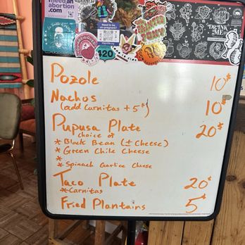 Gobble This - Menu the day we went - Whiteboard menu with food items like Pozole, Nachos, Pupusa Plate, Taco Plate, and Fried Plantains, with prices and options, decorated with stickers. - Salvadoran Near Me - Albuquerque, New Mexico