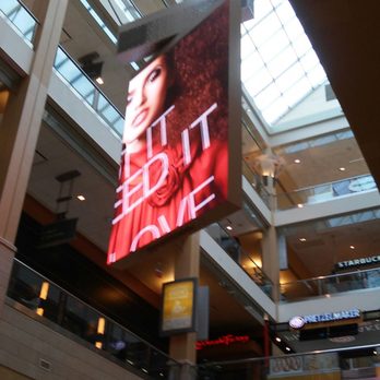 Queens Center - Revolving plasma screen to hypnotize you into buying - Shopping Centers Near Me - Elmhurst, New York