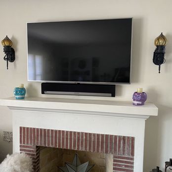 Installation King - AFTER - Aahh nice and neat! Tucked the Mac Mini and AppleTV behind the mounted TV also. - Home Theatre Installation Near Me Installation King - AFTER - Aahh nice and neat! Tucked the Mac Mini and AppleTV behind the mounted TV also. - Home Theatre Installation Near Me
