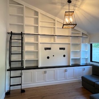 Steve's Wood Working - Here's an intermediate view, completely built and painted. Notice the section on the right with the shelves that angle back to the wall. - Carpenters Near Me Steve's Wood Working - Here's an intermediate view, completely built and painted. Notice the section on the right with the shelves that angle back to the wall. - Carpenters Near Me