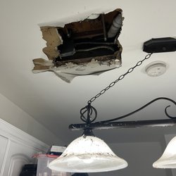RP Professional Home Improvement - Kitchen ceiling damage from the leaking shower base.