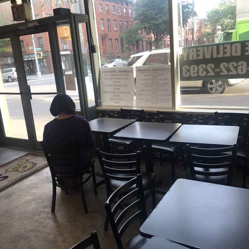 Bony's Bagels - a man sitting at a table - Bagels Near Me - Brooklyn, New York Bony's Bagels - a man sitting at a table - Bagels Near Me - Brooklyn, New York