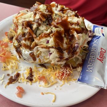 Mojos BBQ & Grill - Loaded baked potato - Barbeque Near Me - Fulton, Missouri Mojos BBQ & Grill - Loaded baked potato - Barbeque Near Me - Fulton, Missouri