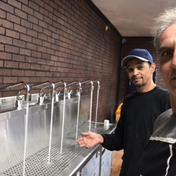 Allsup's Convenience Store - a man standing in front of a row of sinks - Convenience Stores Near Me - Riverside, California Allsup's Convenience Store - a man standing in front of a row of sinks - Convenience Stores Near Me - Riverside, California