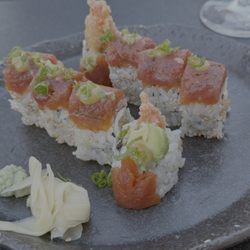 Next Door by Wegmans - Red dragon sushi roll with tempura shrimp, cream cheese, avocado, spicy tuna, and sweet miso