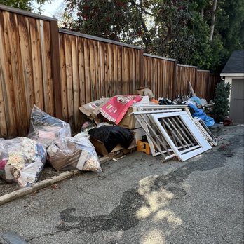 Lunkers Hauling - Side yard junk. - Junk Removal & Hauling Near Me