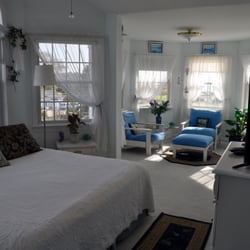 A Victorian on the Bay - Bayview Suite. Bright room which has a semi-private balcony and amazing views of the Harbor next door