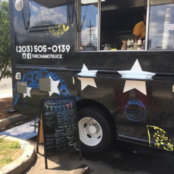 The Chamo - a black food truck with stars painted on it - Food Trucks Near Me
