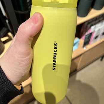 Starbucks - a hand holding a yellow starbucks tumbler - Coffee & Tea Near Me - Harrisburg, Pennsylvania Starbucks - a hand holding a yellow starbucks tumbler - Coffee & Tea Near Me - Harrisburg, Pennsylvania