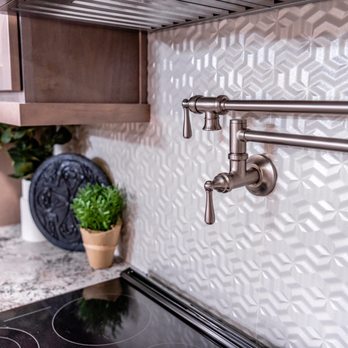 S&K Contracting - a kitchen with a stove top and a potted plant - General Contractors Near Me - Auburn, Washington
