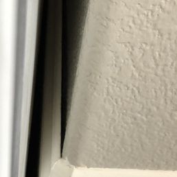 Baseboard by the fridge is floating off the wall. Baseboard by the fridge is floating off the wall.
