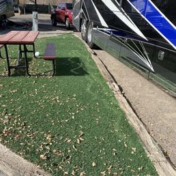 Fake grass. Trash. Not KOA standards.
