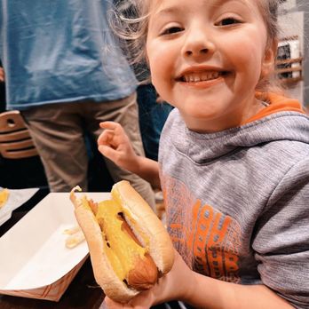 The Mad Tap - My daughter eating a hot dog - Beer Bar Near Me - Tipton, Indiana