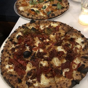 Folk - Sun gold tomato pizza in the back and sweet pepper pizza in the front. - New American Near Me - Nashville, Tennessee