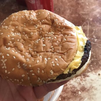 Burger King - a hand holding a hamburger with cheese and lettuce - Burgers Near Me - Mount Sterling, Kentucky Burger King - a hand holding a hamburger with cheese and lettuce - Burgers Near Me - Mount Sterling, Kentucky