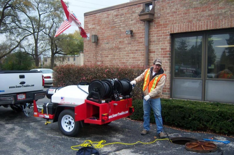 Slide of Suburban Sewer & Septic