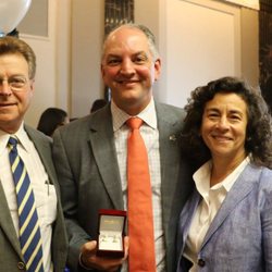 Jules Madere Creative Jewelers - Wayne and Alice Madere with Governor John Bel Edwards holding the custom made cuff links his cabinet commissioned for his birthday.