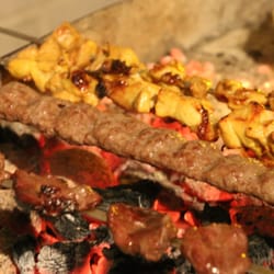 Mehrdad's Persian Kitchen - Kenjeh, Koobideh and Joojeh Kebabs cooking over the charcoal
