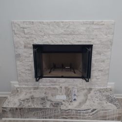 Ready Roofing Repairs - Wood burning prefab installation with surround.