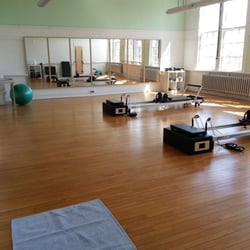 Jann Jette Studio - A bright & beautiful Pilates studio offering Pilates Reformer classes & private sessions, Barre & Iron Yoga classes in downtown Bristol, RI.