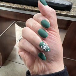 Seattle Nails & Waxing - Green matte gel nail with a snowflake