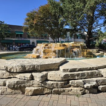 Village Green - Fountain near the entrance. Background shows some of the eateries across the street. - Parks Near Me - Northbrook, Illinois Village Green - Fountain near the entrance. Background shows some of the eateries across the street. - Parks Near Me - Northbrook, Illinois