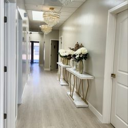 Thai Spa - Beautifully decorated hallway -- very clean and elegantly adorned with beautiful flowers and chandeliers