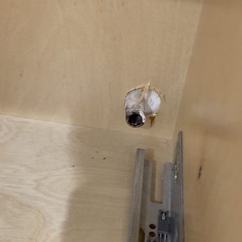 Regal Construction & Remodeling - Open sewer pipe left in brand new kitchen cabinet. - General Contractors Near Me - Tarzana, California